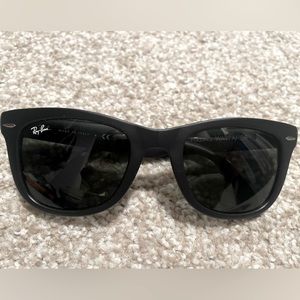 Ray Ban sunglasses.  Black. Foldable with carrying case.